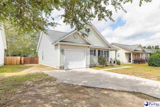 view of front of home featuring a garage and a front lawn