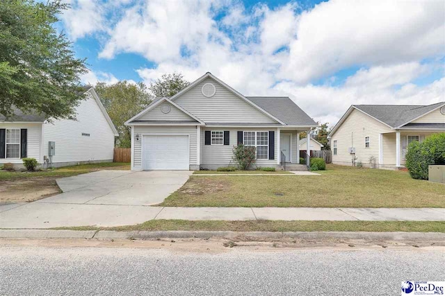 view of front of property featuring a garage and a front yard