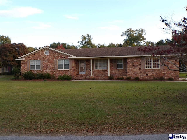 203 Carolina Ct, Mullins, SC 29574 - ranch-style home featuring a front yard