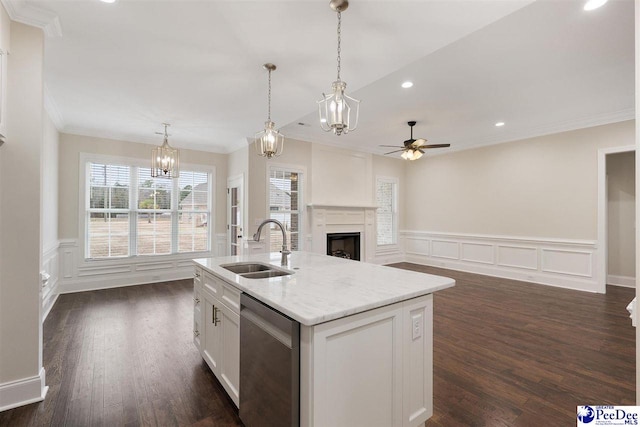 kitchen featuring white cabinetry, dishwasher, sink, an island with sink, and light stone countertops