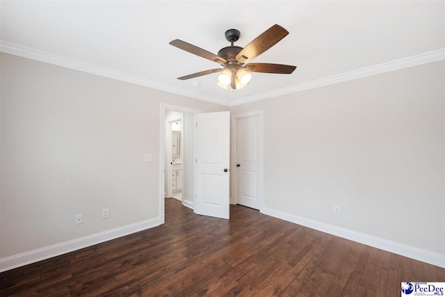 empty room with ornamental molding, dark hardwood / wood-style floors, and ceiling fan