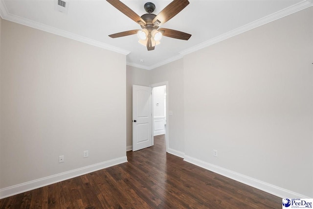 empty room with ornamental molding, dark hardwood / wood-style floors, and ceiling fan