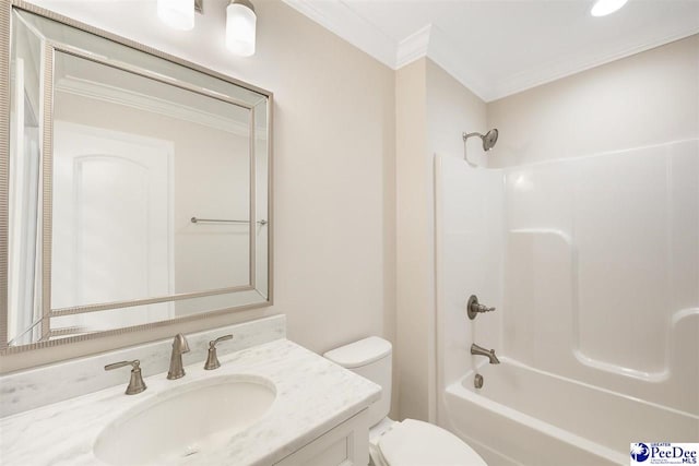 full bathroom featuring vanity, crown molding, shower / washtub combination, and toilet