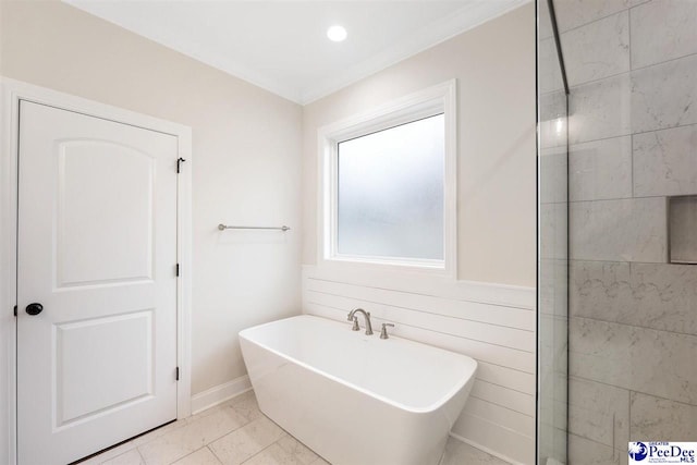 bathroom with a bathing tub and crown molding