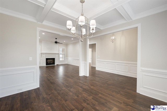 unfurnished living room with dark hardwood / wood-style flooring, beam ceiling, ceiling fan with notable chandelier, and coffered ceiling