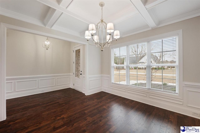 unfurnished dining area with an inviting chandelier, coffered ceiling, beam ceiling, and hardwood / wood-style flooring