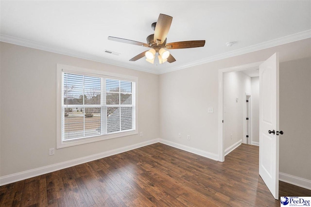 unfurnished room featuring crown molding, dark hardwood / wood-style floors, and ceiling fan