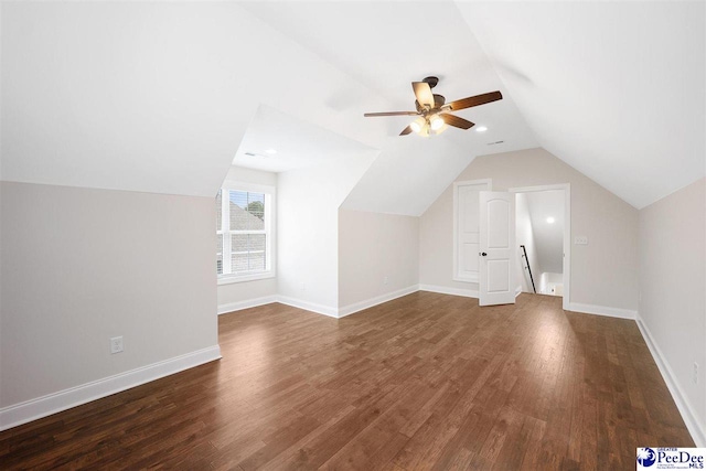 bonus room featuring ceiling fan, dark hardwood / wood-style floors, and vaulted ceiling