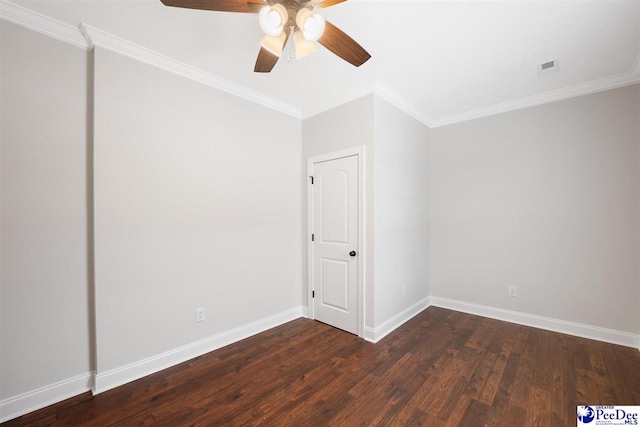 empty room featuring ornamental molding, dark hardwood / wood-style floors, and ceiling fan