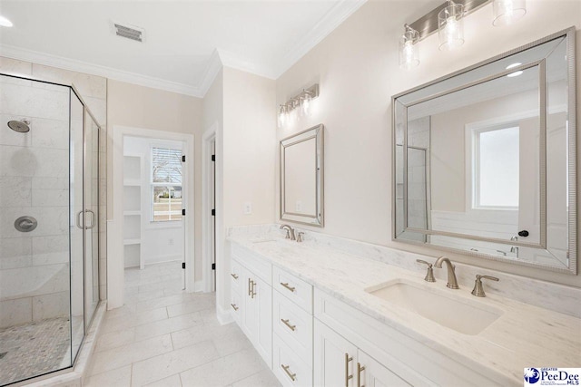 bathroom featuring an enclosed shower, vanity, and ornamental molding