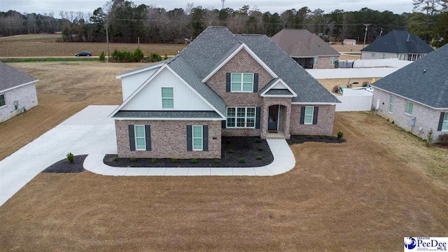 craftsman house with a front lawn