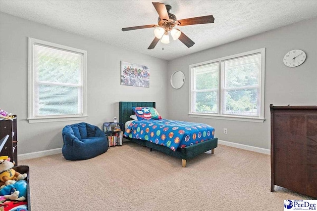 3900 Claussen Rd, Florence, SC 29505 - carpeted bedroom featuring a textured ceiling and ceiling fan