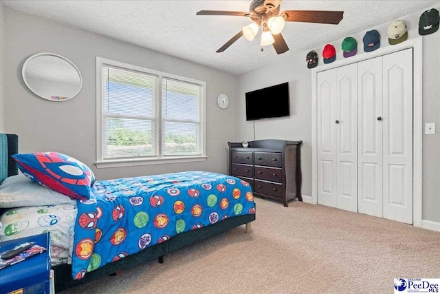 3900 Claussen Rd, Florence, SC 29505 - carpeted bedroom featuring a closet, a textured ceiling, and a ceiling fan