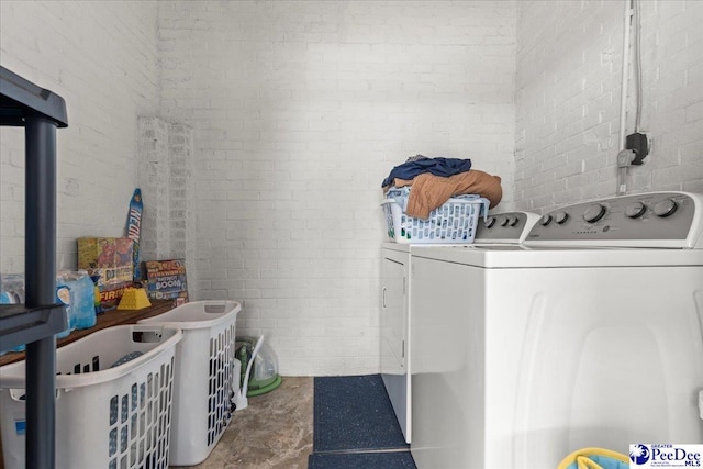 3900 Claussen Rd, Florence, SC 29505 - laundry area with washing machine and clothes dryer and brick wall