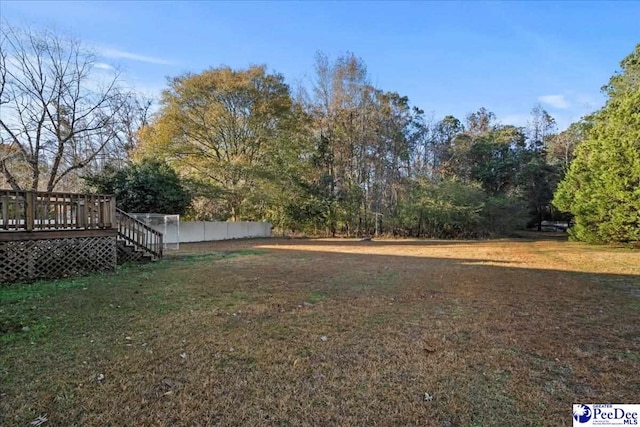 view of yard with a wooden deck