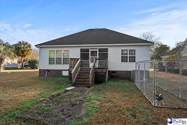 back of house with a yard