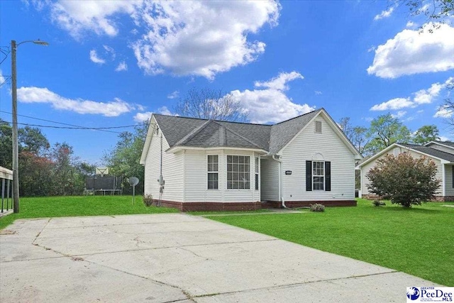 813 Williams St, Lake City, SC 29560 - view of front of house featuring roof with shingles and a front lawn