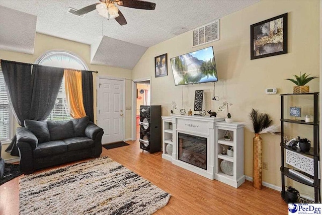 813 Williams St, Lake City, SC 29560 - living room featuring visible vents, wood finished floors, ceiling fan, and a textured ceiling
