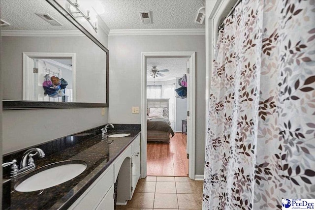 813 Williams St, Lake City, SC 29560 - full bath featuring tile patterned flooring, a sink, and a textured ceiling