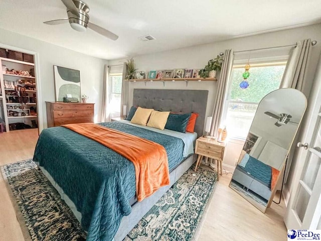 bedroom with wood finished floors and a ceiling fan