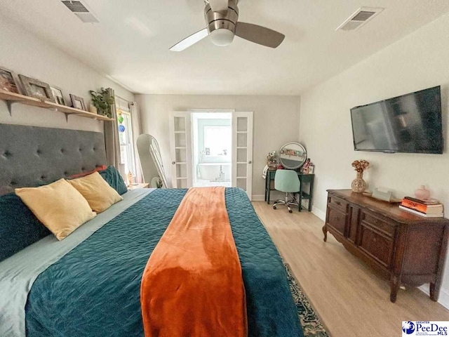 3127 Kenfield Ln, Florence, SC 29505 - bedroom featuring wood finished floors, a ceiling fan, and connected bathroom
