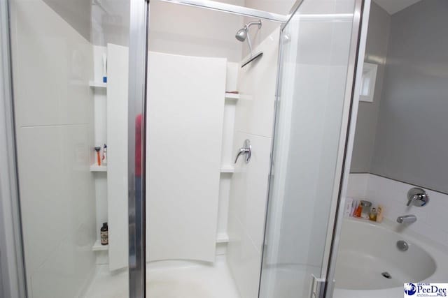 bathroom featuring shower with separate bathtub