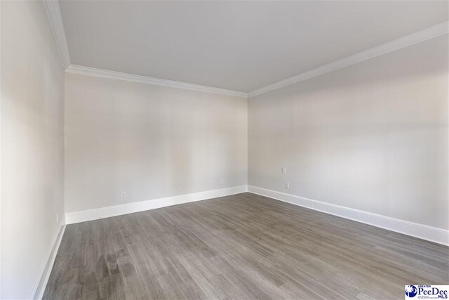 400 Millstone Rd, Florence, SC 29505 - empty room with crown molding, wood finished floors, and baseboards