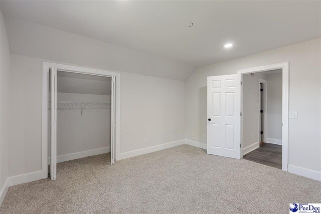 400 Millstone Rd, Florence, SC 29505 - unfurnished bedroom featuring carpet floors, vaulted ceiling, baseboards, recessed lighting, and a closet
