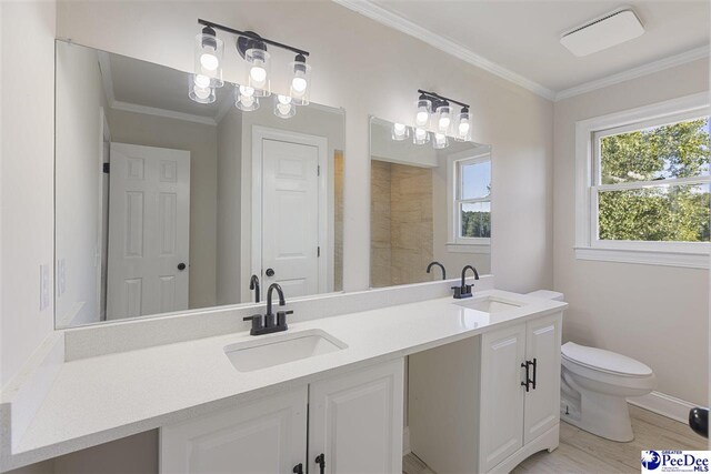 400 Millstone Rd, Florence, SC 29505 - full bath featuring double vanity, toilet, ornamental molding, wood finished floors, and baseboards