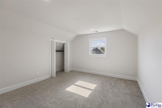 400 Millstone Rd, Florence, SC 29505 - unfurnished bedroom featuring lofted ceiling, light carpet, baseboards, and a closet