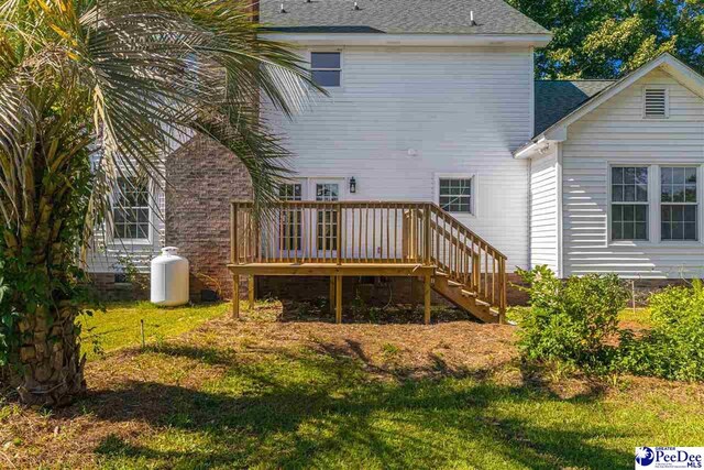 400 Millstone Rd, Florence, SC 29505 - rear view of house featuring a wooden deck, a shingled roof, and stairs