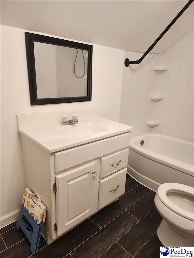 full bathroom featuring vanity, tub / shower combination, and toilet