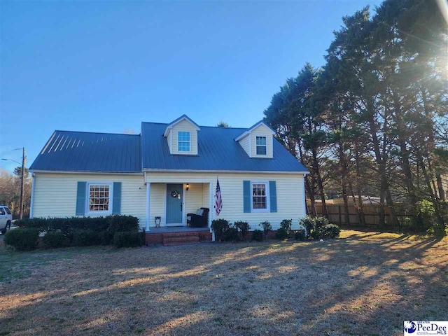 cape cod home featuring a porch