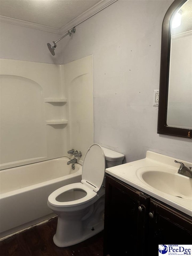 full bathroom featuring a textured ceiling, toilet, vanity, tub / shower combination, and crown molding