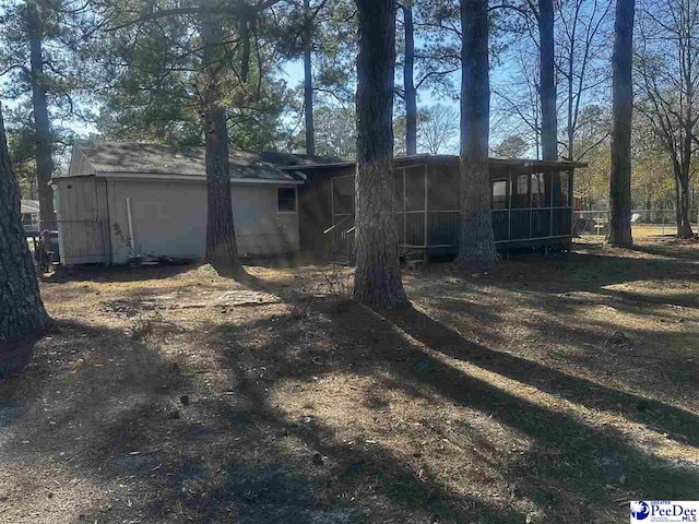 rear view of house with a sunroom