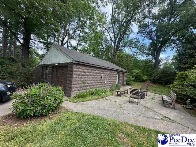 view of outdoor structure with an outdoor structure and a fire pit