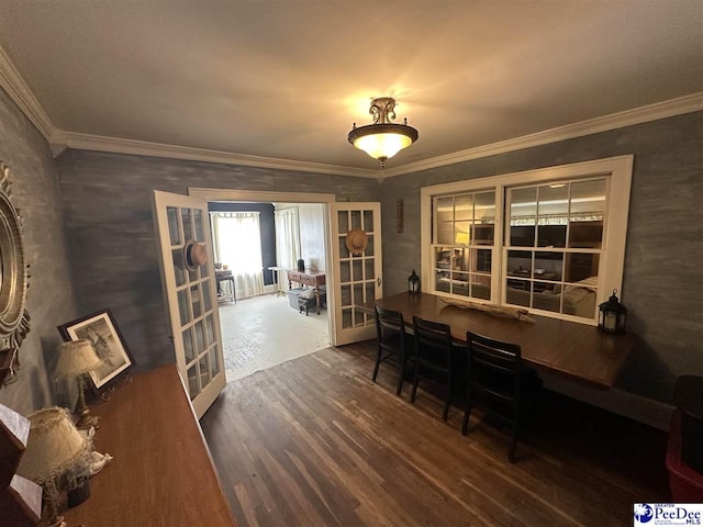 dining area featuring french doors, wood finished floors, crown molding, and a desk