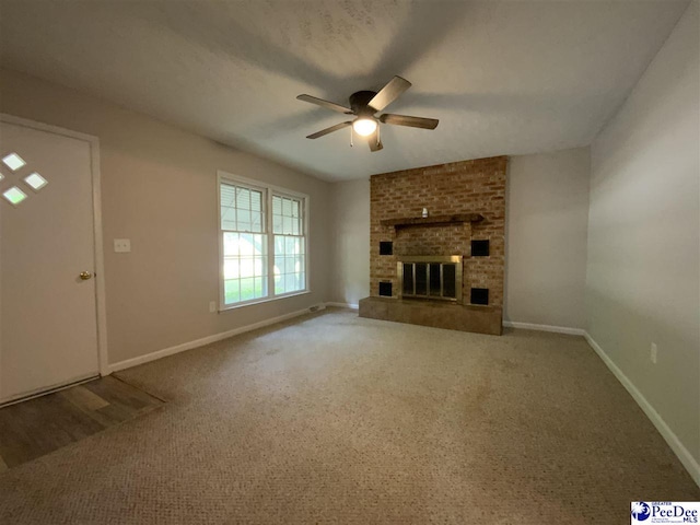 125 Forest Dr, Bennettsville, SC 29512 - unfurnished living room featuring a ceiling fan, baseboards, and a fireplace
