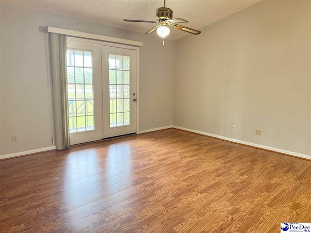 1215-G Brittany Dr, Florence, SC 29501 - spare room featuring wood finished floors, baseboards, and ceiling fan