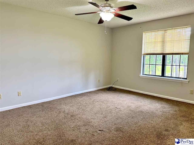 1215-G Brittany Dr, Florence, SC 29501 - carpeted empty room featuring a textured ceiling, ceiling fan, and baseboards