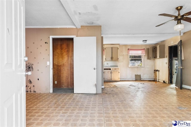 unfurnished living room with ceiling fan