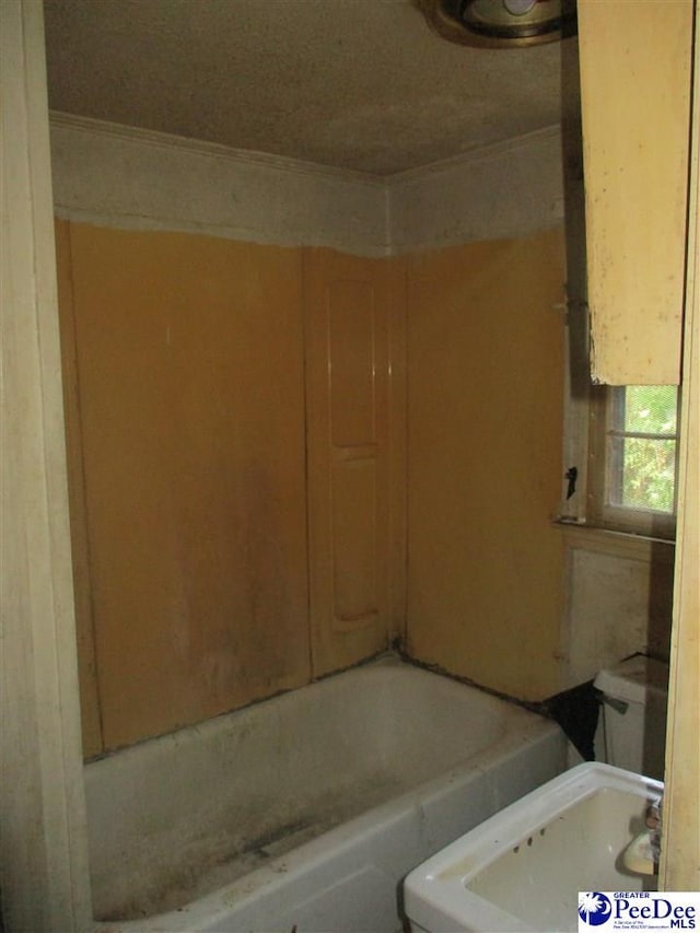 bathroom featuring a bathing tub and sink