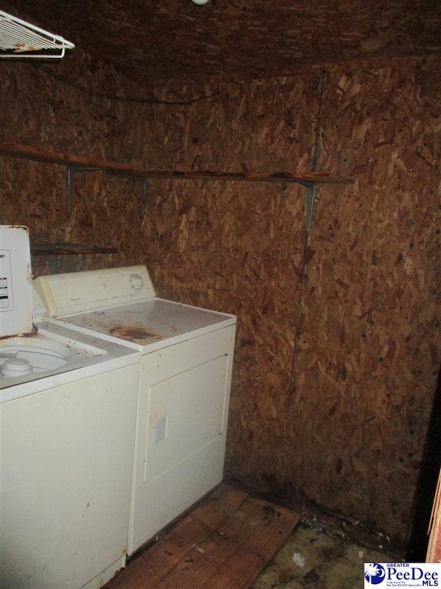 clothes washing area with washer and dryer