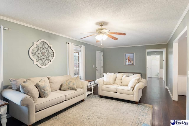 living room with ornamental molding, hardwood / wood-style floors, a textured ceiling, and ceiling fan