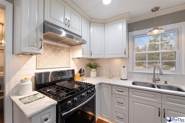 kitchen featuring sink, white cabinets, and gas range oven