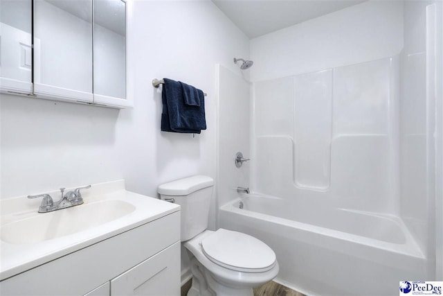 bathroom featuring shower / bath combination, toilet, and vanity