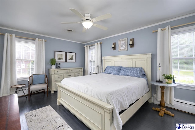 bedroom with crown molding, visible vents, a ceiling fan, and dark wood finished floors
