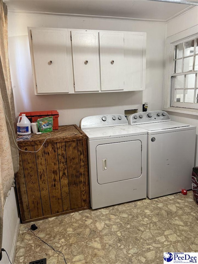 laundry area featuring cabinets and independent washer and dryer