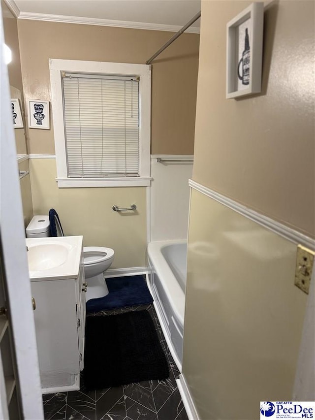 full bathroom with crown molding, tub / shower combination, toilet, vanity, and marble finish floor