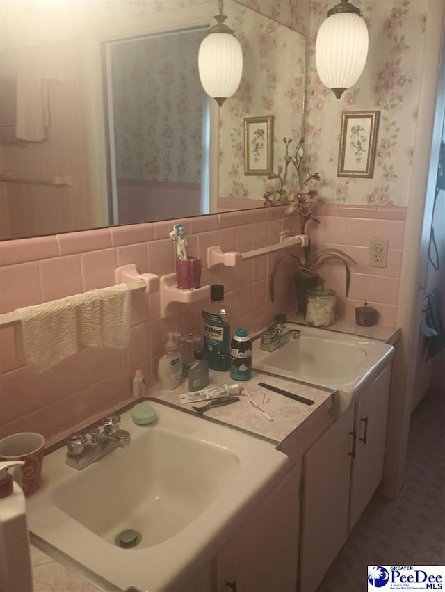 1815 Hampton Dr, Florence, SC 29505 - bathroom with wallpapered walls, vanity, and wainscoting